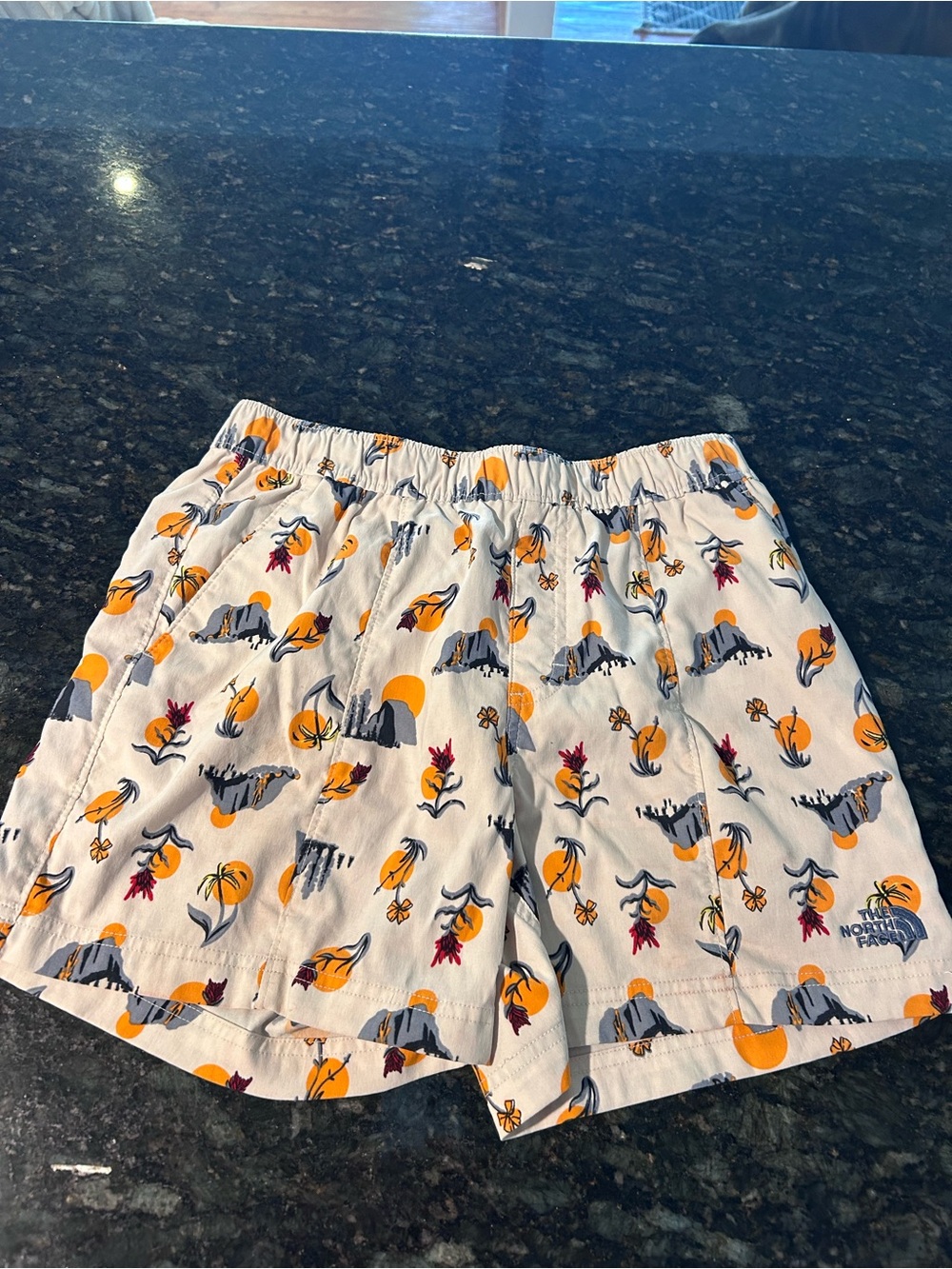 The North Face White Athletic Shorts with Orange, Navy & Pink Print